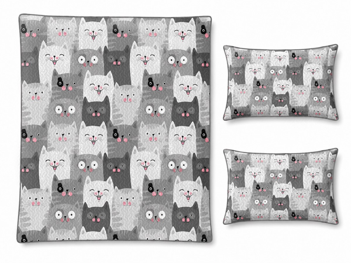 Flat lay of cat comforter set with coordinated pillow shams and printed details